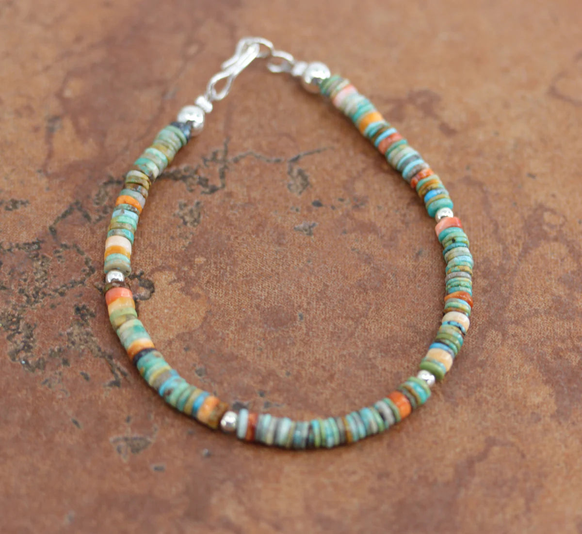 A beautiful Navajo Style bracelet. It is about 7 1/2" from end to end and 3/16" wide. 

